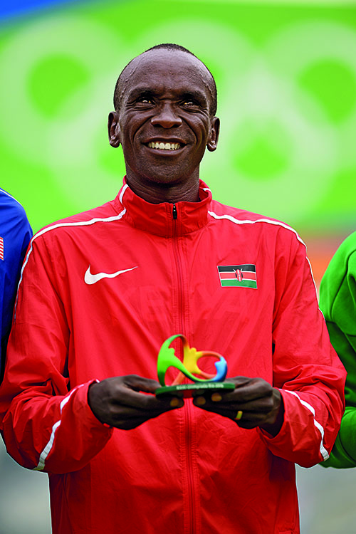 RIO DE JANEIRO, BRAZIL - AUGUST 21: Gold medalist Eliud Kipchoge of Kenya celebrates on the podium during victory ceremony after the Men's Marathon on Day 16 of the Rio 2016 Olympic Games at Sambodromo on August 21, 2016 in Rio de Janeiro, Brazil. (Photo by Quinn Rooney/Getty Images)