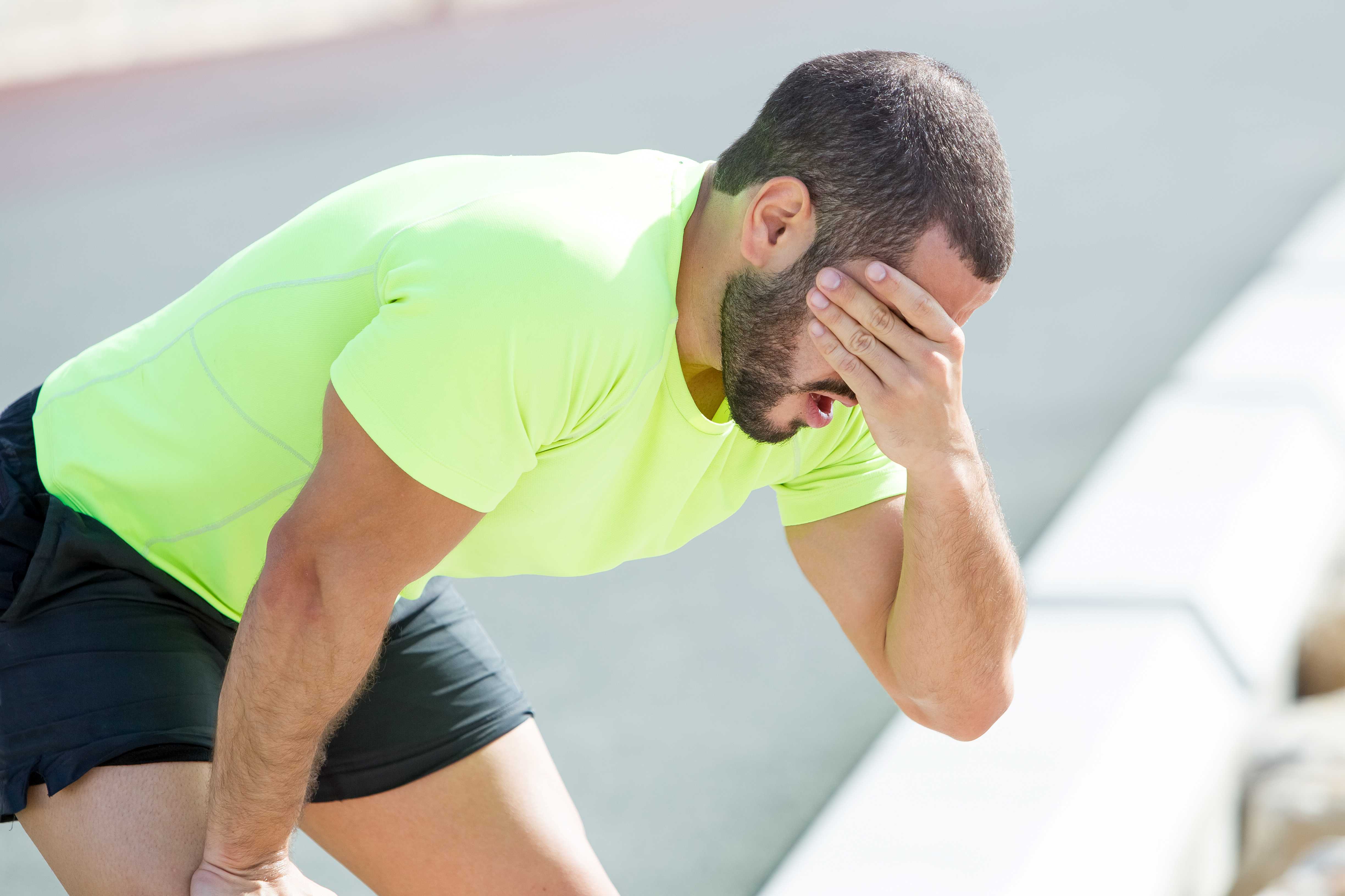 tired-sporty-man-relaxing-covering-face_RESIZE
